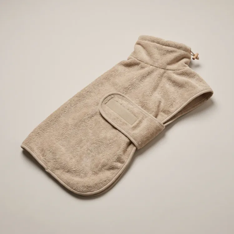 The Drying Coat in Sand